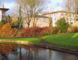 a painting of a house next to a body of water at Annebrook House Hotel in Mullingar