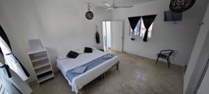 Postel nebo postele na pokoji v ubytování Casa Universo Holbox