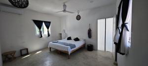 Postel nebo postele na pokoji v ubytování Casa Universo Holbox