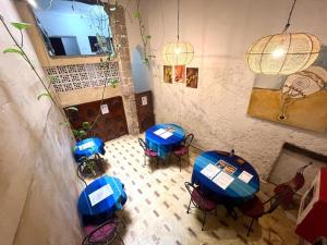 an overhead view of a room with tables and chairs at Dar Latigeo in Essaouira