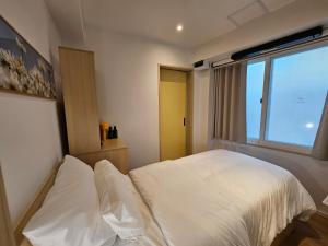 Hotel Marguerite Seoul房間的床