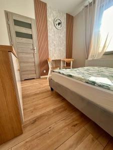Łóżko lub łóżka w pokoju w obiekcie Pensjonat Zatoka 17