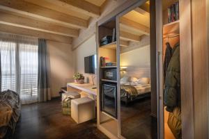 A bed or beds in a room at Brenta Dolomites