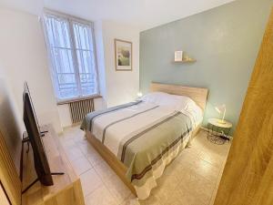 En eller flere senge i et værelse på Studio accueillant et calme centre ville Tarbes