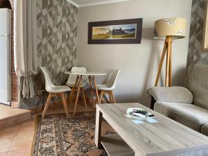 a living room with a couch and a table at Marbella Apartment in Marbella