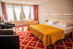 Postel nebo postele na pokoji v ubytování Hotel Restaurant Boschlust