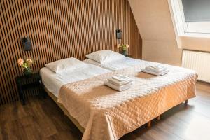 Postel nebo postele na pokoji v ubytování Hotel Restaurant Boschlust