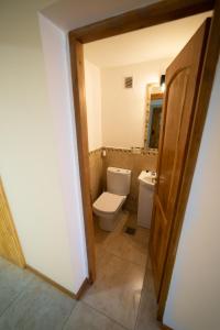 a bathroom with a toilet and a sink at Ventanas al Sur - Espacio Bandurrias - in San Martín de los Andes +23 photos
