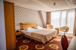 Postel nebo postele na pokoji v ubytování Hotel Restaurant Boschlust