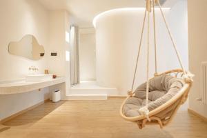 a hanging chair in a bathroom with a sink at EUPHORIA丨Quiet Garden Quiet Designer Garden Hotel丨Datang Never Sleeps City Big Wild Goose Pagoda Subway Station Branch丨Near the scenic area in Xi'an