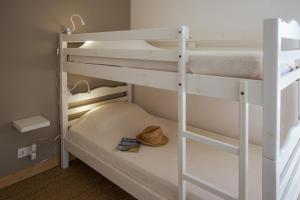 Ένα ή περισσότερα κρεβάτια σε δωμάτιο στο A deux pas du port