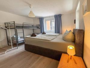 a bedroom with two bunk beds and a window at Villa Amselgrund in Rathen