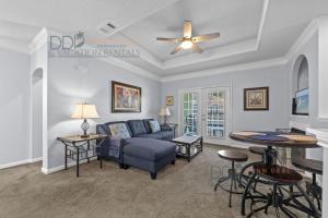 a living room with a couch and a table at Legacy Villa 504 in Gulfport