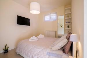 En eller flere senge i et værelse på Casa Barabba - Appartamento Azzurro