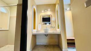 a bathroom with a sink and a mirror at Casa Grande Hotel Boutique in Comitán de Domínguez