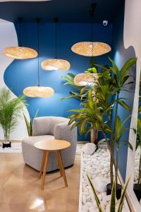 a room with chairs and a table and lights at Carvi Beach Hotel in Lagos