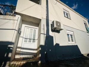 a building with a air conditioner on the side of it at Svetli dom in Sutomore