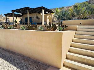 a house with stairs and plants in front of it at Casa Corazon - Private Home w Mtn & Ocean Views! in El Pescadero