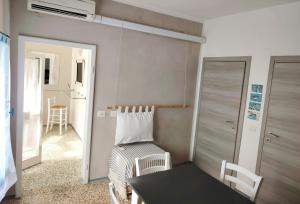 a small room with a table and a chair at Cavo Beach 6 in Cavo