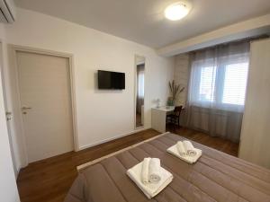 Postel nebo postele na pokoji v ubytování Attico 25