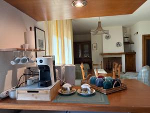 a kitchen with a table with a coffee maker on it at Oltre le mura in Spello