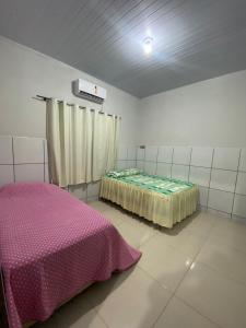 En eller flere senge i et værelse på SA Temporadas