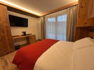 Postel nebo postele na pokoji v ubytování Agritur Bella di Bosco