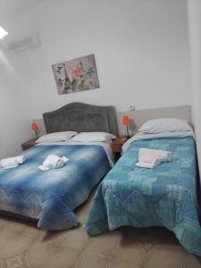 Postel nebo postele na pokoji v ubytování Torre di Amalfi - holiday house