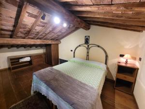 Postel nebo postele na pokoji v ubytování La Capanna di Poggio al Lupo