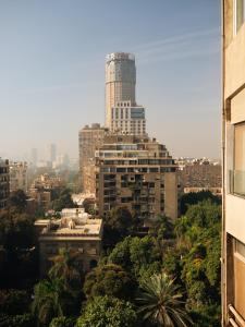 a city with a tall building in the background at Brassbell Zamalek Diplomatic Zone Near Marriott in Cairo