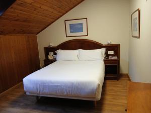 Posteľ alebo postele v izbe v ubytovaní Balneario Caldas de Luna