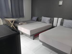 Postel nebo postele na pokoji v ubytování ภูรักษ์รีสอร์ท บ้านกรูด