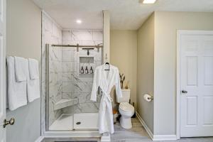 a bathroom with a shower and a toilet at Private Hot Tub and Cold Plunge Fayetteville Gem! in Fayetteville +22 photos