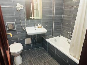 Koupelna v ubytování Hotel Amadeus