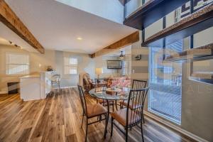 a kitchen and dining room with a table and chairs at Thornsberry Beach Loft in Lake Ozark