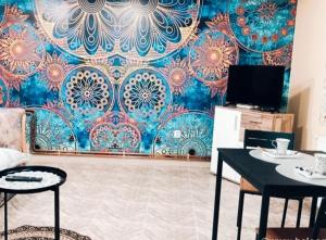 a room with a wall with a blue and red wallpaper at Grb City Center - Apartment Belgrade in Belgrade