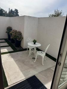 a patio with a table and two chairs and a table at Studio in peaceful gated Single Family Resident community in Laguna Niguel
