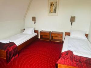 Postel nebo postele na pokoji v ubytování Hotel Amadeus