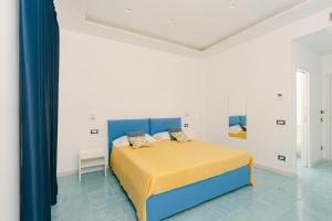 Postel nebo postele na pokoji v ubytování Ravello Essence