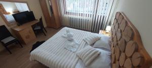 Postel nebo postele na pokoji v ubytování Guest House Planinski Zdravets