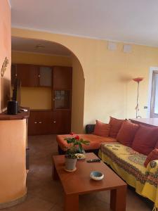 a living room with a couch and a table at Affittacamere Cappuccini in Sassari