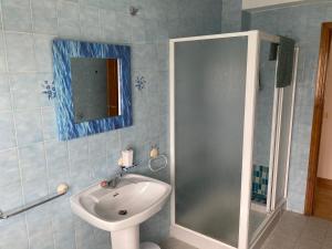 a bathroom with a sink and a shower at Casa Sindo in Teixeira +42 photos