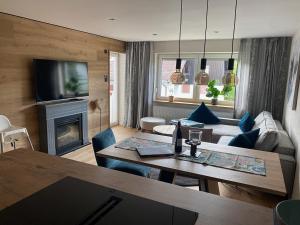 a living room with a table and a couch at Bergidyll in Oberstaufen