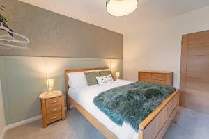 Ένα ή περισσότερα κρεβάτια σε δωμάτιο στο Fort William Cottage ,11 Torlundy Courtyard