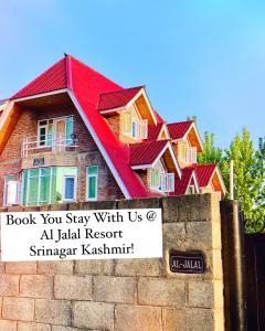 a row of houses with red roofs on a wall at Al Jalal Resort in Srinagar