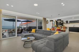 a living room with a couch and a table at Villa Bacula in Veliko Brdo