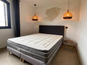 Кровать или кровати в номере MarinesAppartement, Beach Duplex