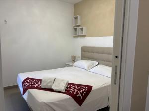 En eller flere senge i et værelse på Appartamento Lidia - vacanze al mare pieno centro - Premium Villas