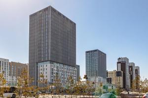 a group of tall buildings in a city at В центре апартаменты ЖК Orynbor Towers in Astana