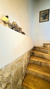 a set of stairs in a room with a picture on the wall at Alexander Dion House in Afitos +33 photos